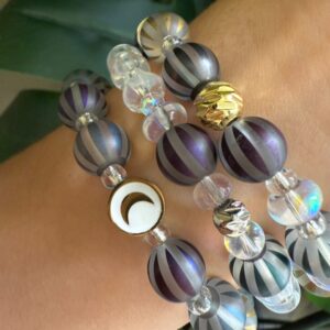 Brown and clear crystal bets with a moon connector